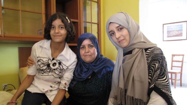 Election observer Houda Ali Habibi with her daughters Orara 19, and Lama, 12.