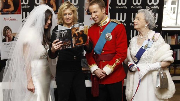 Chances are, they are not amused. Author Alison Jackson poses for a photograph with lookalikes of Kate Middleton, Prince William, Queen Elizabeth and the royal corgis in London... on April Fool's Day.