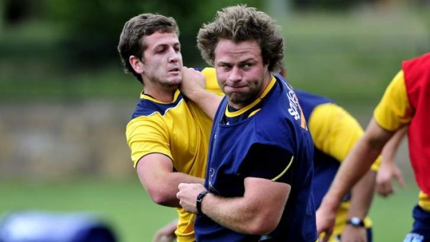 Brumbies front rower Dan Palmer, front, might be disagreeing with teammate Ian Prior on the nature of consciousness.