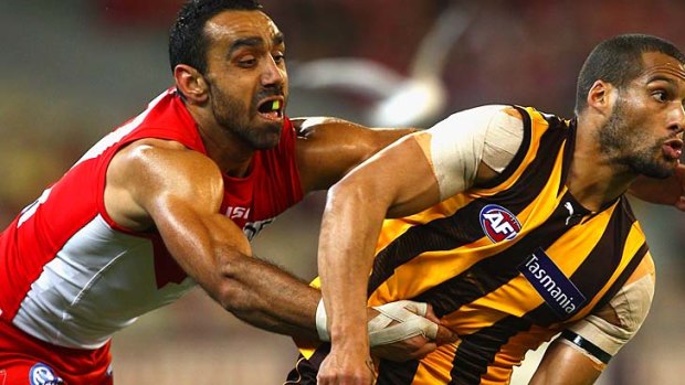 Adam Goodes tackles Josh Gibson during the 2011 second semi final.