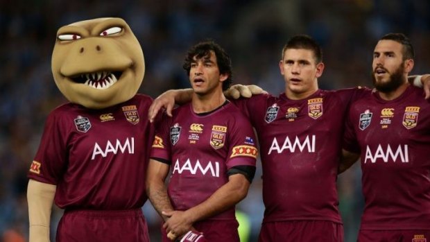 Maroons Johnathan Thurston, Jacob Lillyman and Darius Boyd sing the national anthem before game two of the State of Origin series at ANZ Stadium in Sydney.