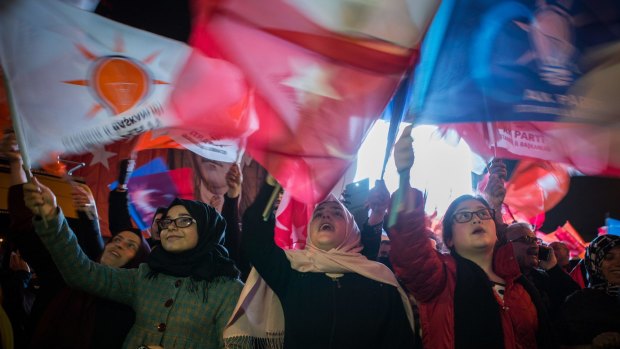 Supporters of the Justice and Development Party, also known as AK Party or AKP, celebrate following the result of the Turkish general election in Istanbul on Sunday. 