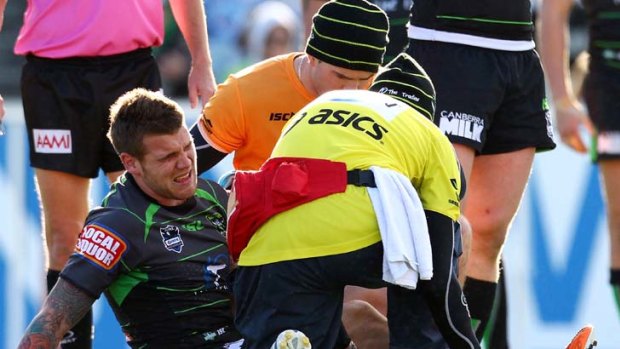 Sideline bound &#8230; fullback Josh Dugan goes down to an ankle injury in the Raiders' round 13 match with the Cowboys.