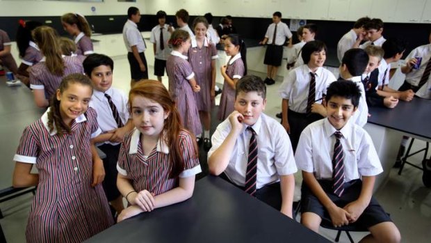 A new start: Auburn High School year 7 students show off their redesigned uniforms in the science wing.