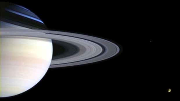 Saturn with its moon, Titan (Image from Cassini spacecraft, digitally enhanced).