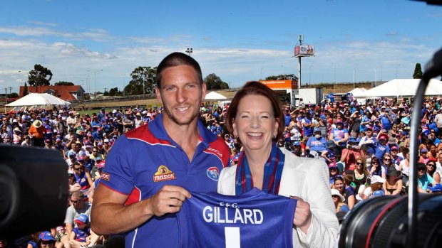 Julia Gillard is presented with the no. 1 jumper at today's Western Bulldogs family day in Melbourne.