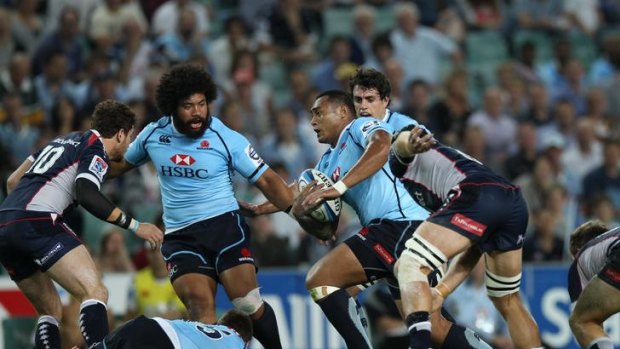 The Rebels try to hold back a Waratahs attack.