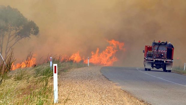 A grass fire was burning out of control near Oura, east of Wagga Wagga on Monday.
