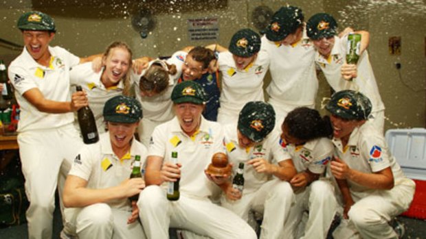 Spot the trophy ... the Southern Stars celebrate after achieving what the national men's team could not - regaining the Ashes.