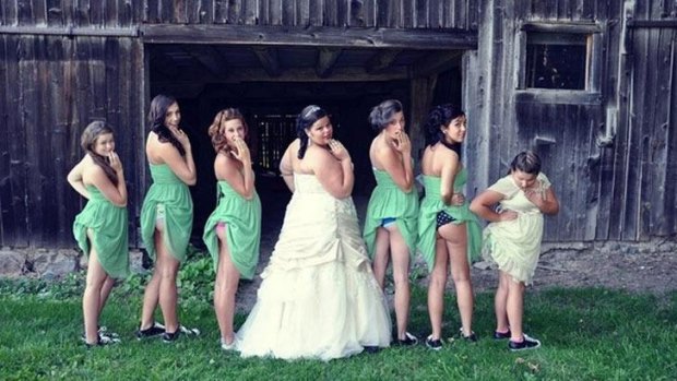 Bridesmaids tuck their dresses into their knickers.