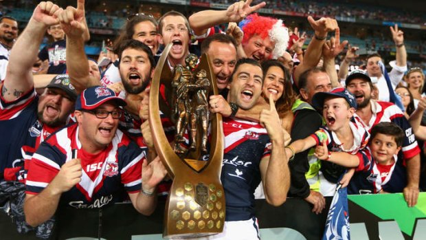 Special moment:  Roosters captain Anthony Minichiello celebrates with fans after winning the grand final on Sunday.