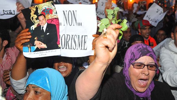 Moroccan demonstrators denounce terrorism.