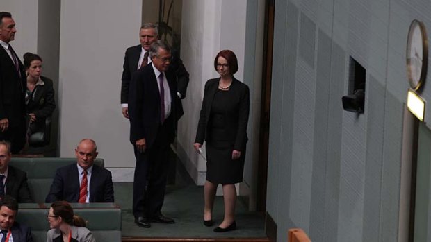Former prime minister Julia Gillard takes a glance back at the House before leaving question time on Thursday.