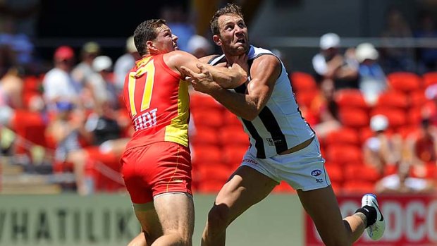 Travis Cloke and Steven May contest a mark.