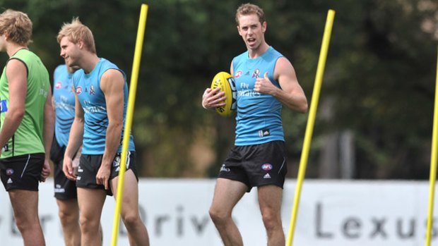 Thumbs up: Collingwood captain Nick Maxwell, who is fit to return against Carlton on Friday night, gestures to Harry O’Brien at training yesterday.