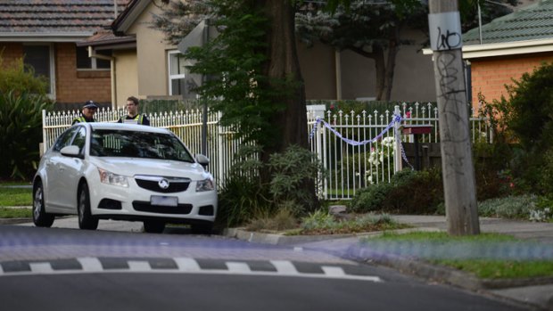 Police tape cordons off the scene of the double fatality.