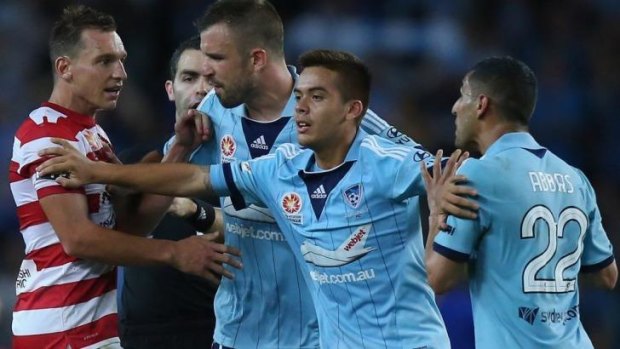 Flashpoint: Wanderers striker Brendon Santalab (left) and Sydney FC's Ali Abbas had to be separated during last Saturday's explosive Sydney derby.
