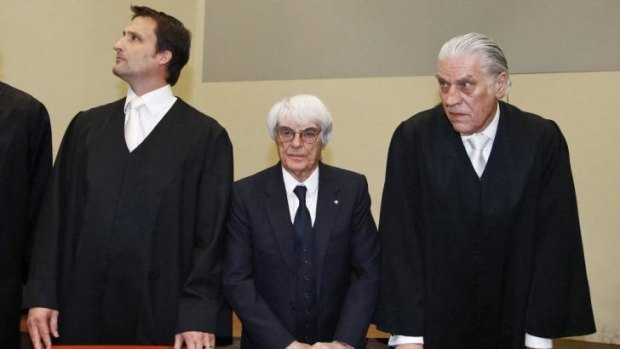 Bernie Ecclestone (centre), the 83-year-old F1 business magnate, with his lawyers. 