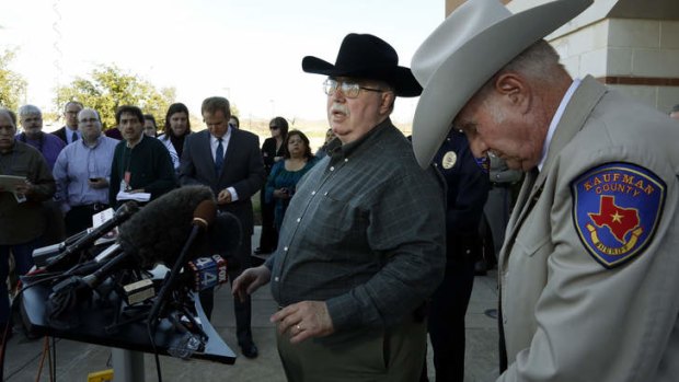 Mike McLelland, centre, at the media conference in January at which he denounced the killers of Mark Hasse as "scum".