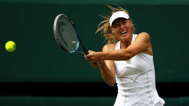 Love being back ... Maria Sharapova during her victory over Sabine Lisicki during the women's  semi-finals at Wimbledon. She is striving for her fourth grand slam after a seven-year hiatus.