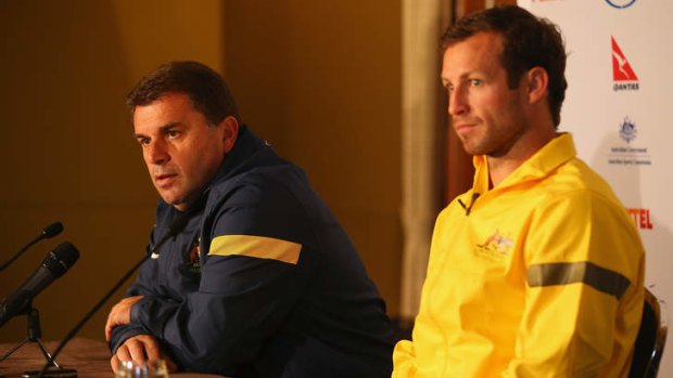 Socceroos coach Ange Postecoglou with captain Lucas Neill.