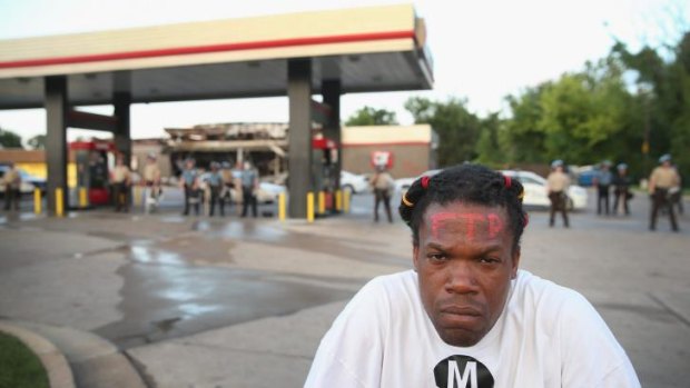 Marlon Carter, a rap musician from Kansas City, stayed in St Louis after his performance to join a protest over the killing of 18-year-old Michael Brown, who was shot by police on Saturday.