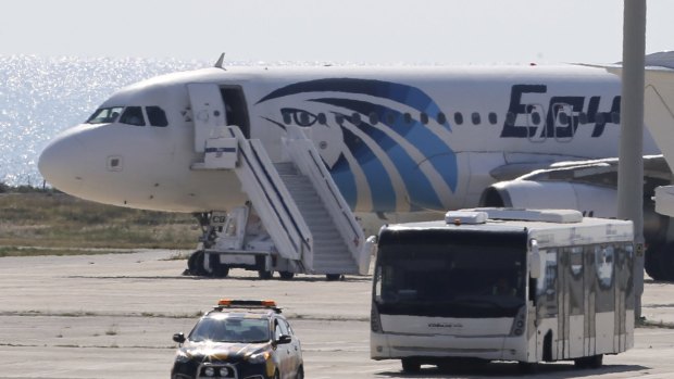 A bus carrying passengers from the hijacked EgyptAir aircraft at Larnaca Airport.