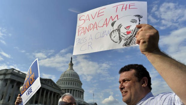 Plea for the pandas: Protesters call for the continuous running of PandaCam at the closed National Zoo in Washington.