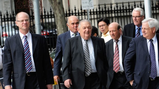 Centro lawyer David Reichenberg (front centre) outside court with his clients — chairman Paul Cooper (far left), non-executive directors Peter Wilkinson and Sam Kavourakis, former chairman Brian Healey and board member Jim Hall.