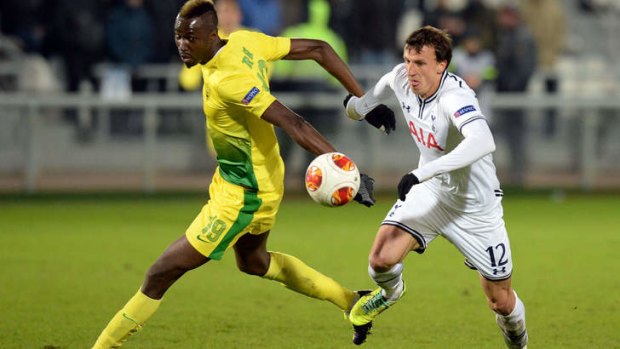 Tottenham's defender Vlad Chiriches, right, proves a handful for Anji Makhachkala's defence.