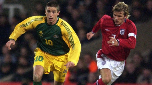 Harry Kewell gets away from David Beckham during the international friendly at Upton Park in 2003.