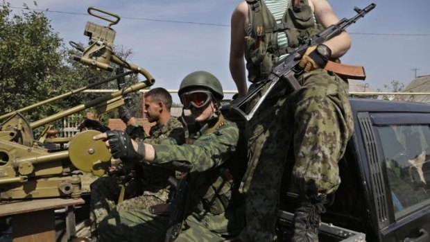 Pro-Russian rebels with a heavy machine gun in Donetsk, eastern Ukraine, on the weekend.