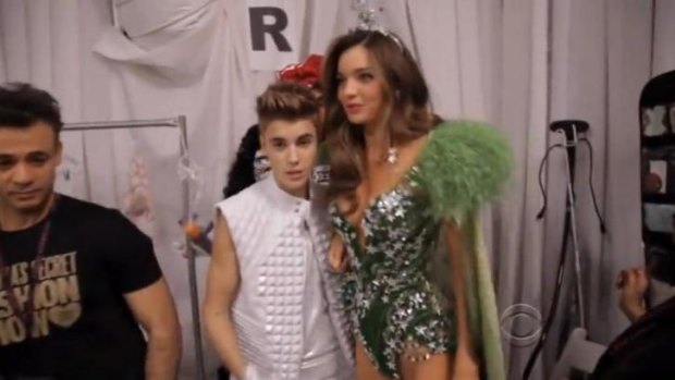 Justin Bieber and Miranda Kerr reportedly met and connected backstage at the 2012 Victoria's Secret show.