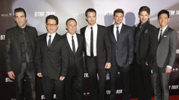 Cast and crew pose at the world premiere of the movie Star Trek at the Sydney Opera House April 7, 2009. They are (L-R) actor Zachary Quinto, director J.J. Abrams, Producer Bryan Burk, actor Chris Pine, actor Karl Urban, actor Eric Bana and actor John Cho.
