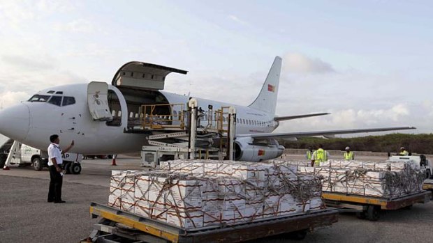 The first airlift of food aid is unloaded after arriving at the Aden Abdulle Osman International Airport in Mogadishu.