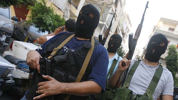 Danger ... gunmen from the al-Mikdad clan parade in Beirut.