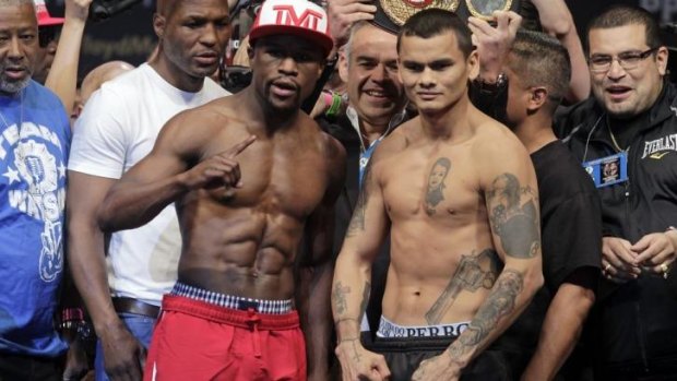 Crowded affair: Mayweather Jr. (L) and Maidana at the weigh-in 