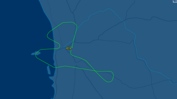 Qantas flight 566 turned back after and indicator light appear in the cockpit.