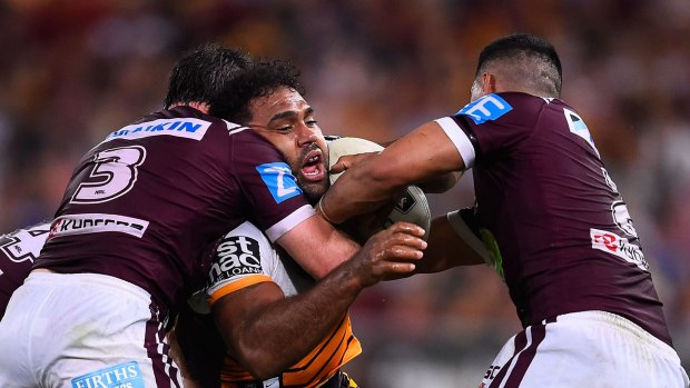 Sam Thaiday of the Broncos is tackled by Jamie Lyon and Matthew Wright at Suncorp Stadiumon Saturday night.