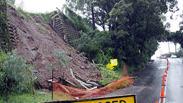 A retaining wall collapse blocks the Main Road exit from Wellington Point Reserve, on Brisbane’s bayside. Photo: Chris McCormack