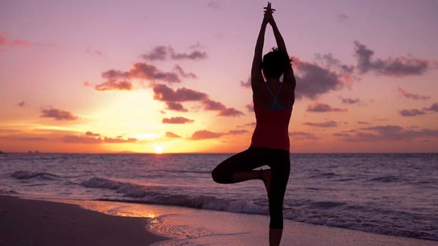 No man's land: Sunset yoga on the beach with Surf Goddess Retreats.