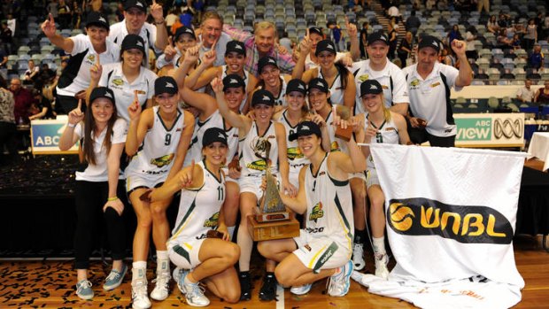 Dandenong rangers celebrate their win in the 2012 grand final over Bulleen Boomers.
