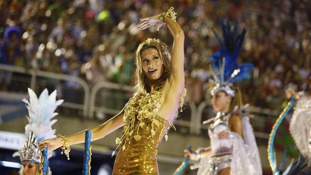 Hello Rio . . . Brazilian top model Gisele Bundchen dances on a Vila Isabel samba school float.
