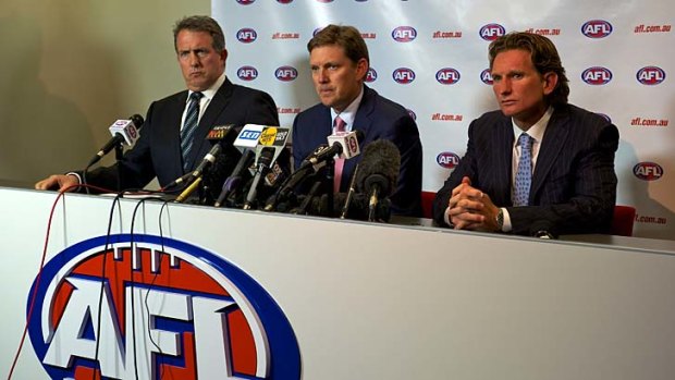 Questions: Essendon CEO Ian Robson, president David Evans and coach James Hird answer questions over alleged illegal substances at a press conference in February.