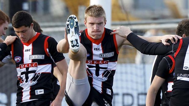 Toss-up: Irishman Tommy Walsh (right) is pushing for a place in St Kilda's team to face North Melbourne.