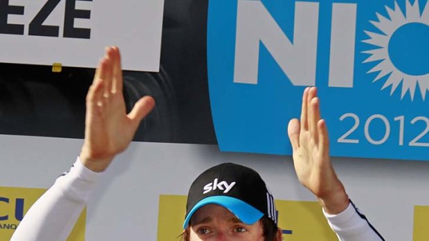 Team Sky rider Bradley Wiggins of Britain celebrates on the podium after winning the 70th Paris-Nice cycling race.