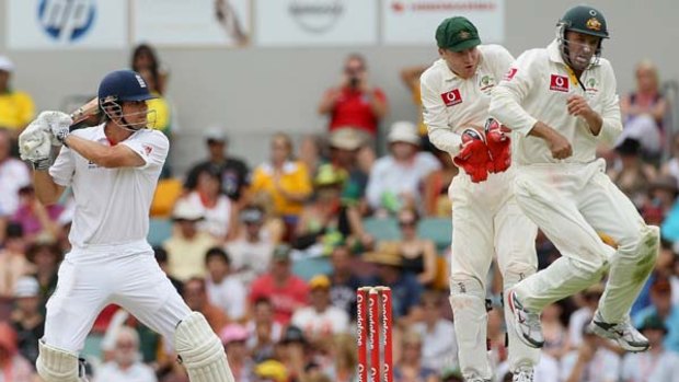 England century-maker Alastair Cook cuts as Australian wicketkeeper Brad Haddin and fieldsman Mike Hussey jump clear during yesterday's play at the Gabba.