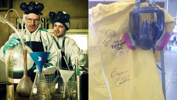Bryan Cranston and Aaron Paul in <i>Breaking Bad</i> and, right, the signed souvenir Hazmat suit.