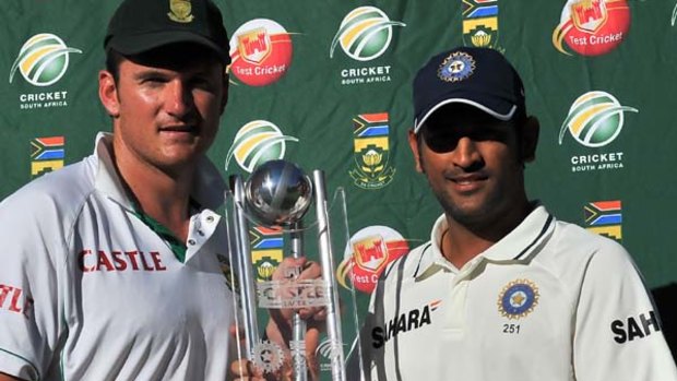 South African captain Graeme Smith and Indian captain Mahendra Singh Dhoni after the fifth day of the third and final Test between India and South Africa in Cape Town.