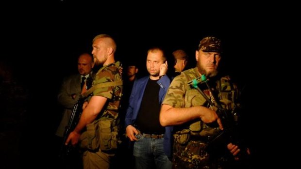 Self-proclaimed Prime Minister of the pro-Russian separatist "Donetsk People's Republic Alexander Borodai arrives at the site of the crashed Malaysian airliner.